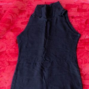 Sleeveless turtleneck body con dress